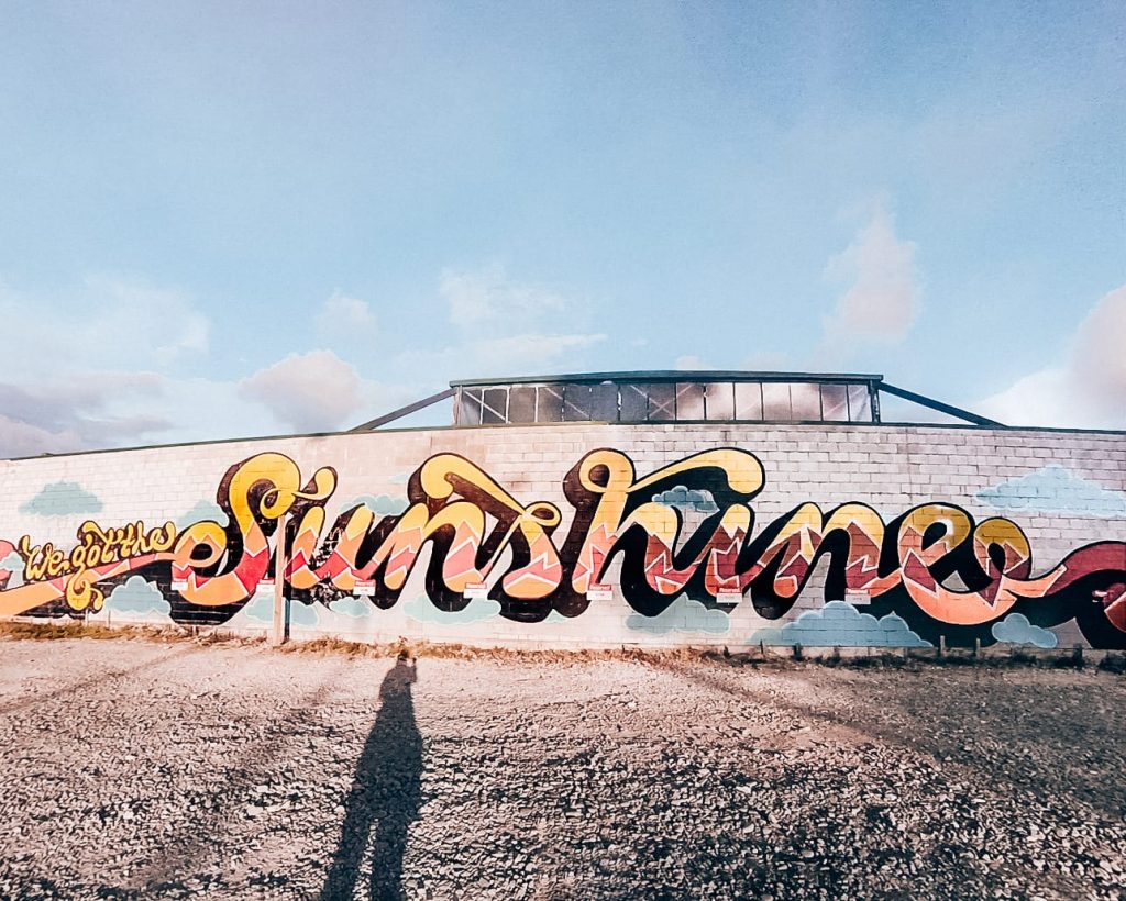 An art mural in Christchurch, New Zealand, saying 'We got the sunshine'