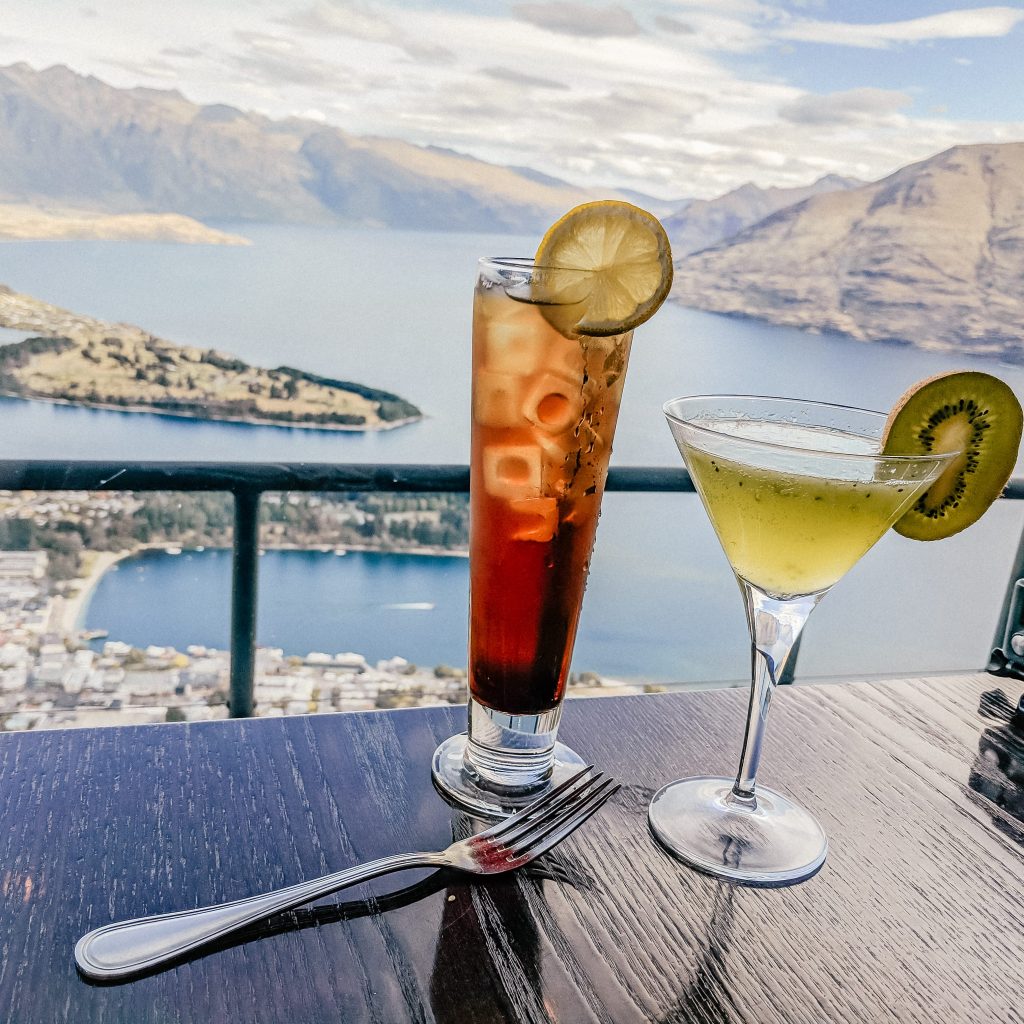 Cocktails overlooking a view of Queenstown