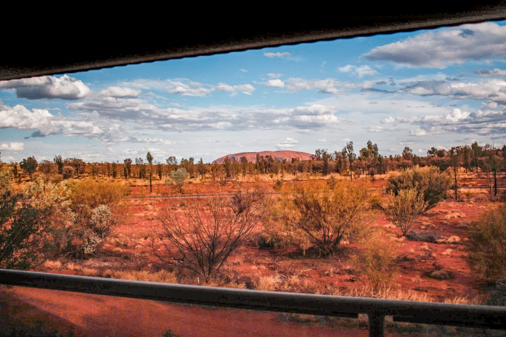 Uluru in the distance, as seen from Desert Gardens Rock View Room