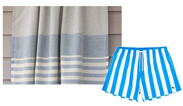 blue beach towel and striped swim shorts