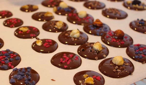 Chocolate with different toppings on a baking tray