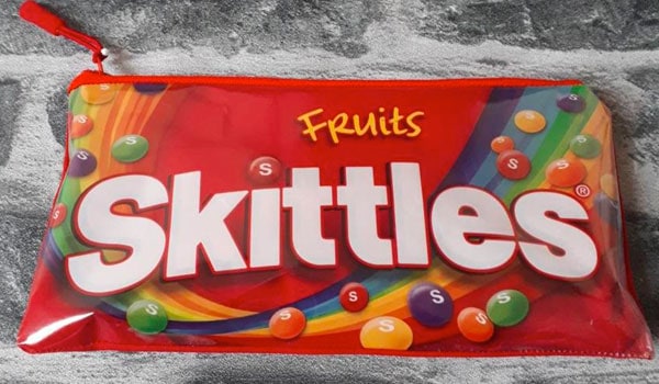 A pencil case made from an old Skittles packet