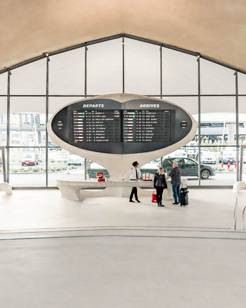 TWA hotel lobby with check in counter that looks like an airport terminal